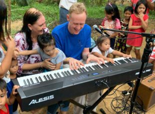 David Stanley playing a keyboard